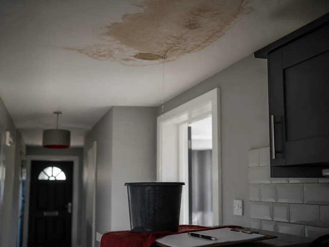 Water damage and staining from a leak on a ceiling